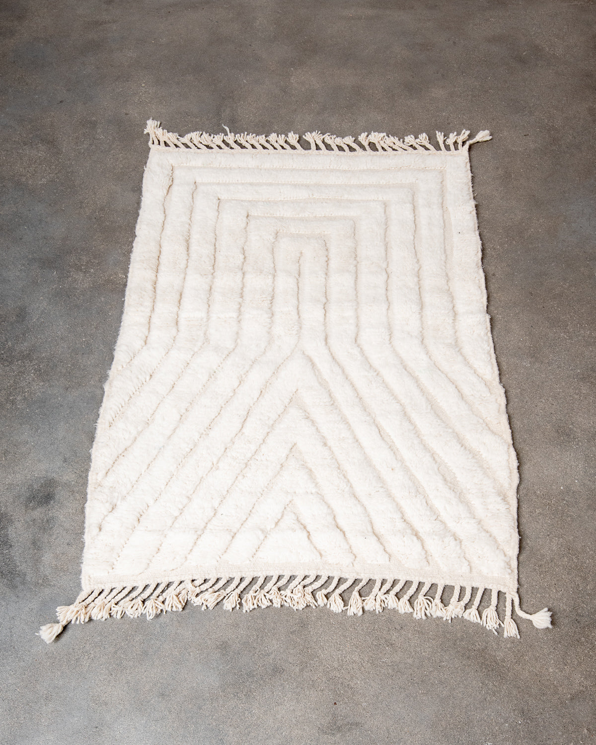 Modern, designer, handcrafted Berber rug from Morocco. Beniourain carpet with minimalist design, natural wool pile and a fluffy texture.
